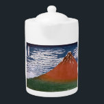 Red Fuji, Aka Fujiyama Volcano Katsushika Hokusai<br><div class="desc">Den scen som fångas i den japanska träblocksutskriften "Bra Vind, Clear Morg" (även känd som "Red Fuji" eller "Aka Fuji") är en spännande visning av berget Fuji som badats i soluppgångens livande nyanser. Denna teckning ingår i Katsushika Hokusais berömda serie, "36 vyer av Mount Fuji", skapat mellan 1830 och 1832....</div>