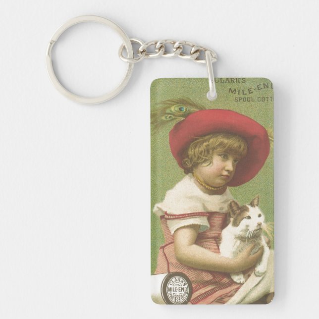 Red Hat Girl Holding A Cat Ephemera Keychain (Framsidan)