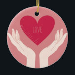 Red Heart kärlek romantic Valentine Day Julgransprydnad Keramik<br><div class="desc">romantisk design av ett starkt rosa hjärta med ord kärlek i mitten och två händer som håller upp hjärtat mot en  rosa. Den här vackra,  gigantiska snyggten är perfekt för valentindagen eller något annat romantiskt tillfälle.</div>