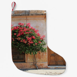 RED PETAL FLOWWER PÅ KONCRETE WALL LITEN JULSTRUMPA