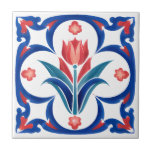 Red Tulip Turkisk Iznik Ceramic Tile Art Kakelplatta<br><div class="desc">Med den här rödturkiska keramiska tilarkonsten av typen Red Tulip Turkisk Iznik, som har en central tulip i röda nyanser av rik som är inramad av elegant blå löv och omgiven av känsliga detaljer om blommigten, drar denna design direkt från det ottomanska rikets klassiska keramiska traditioner av Iznik. Den blåa...</div>