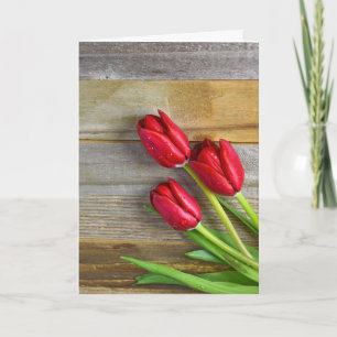 red tulips on wood kort