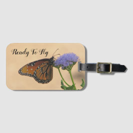 Redo till Fly Monarch vid Lila Flower Butterfly Bagagebricka