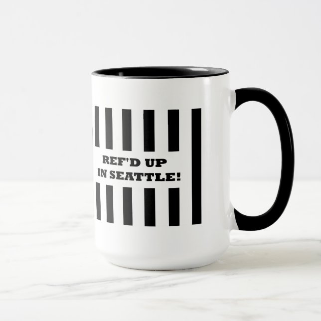 Ref reste i Seattle med ersättningsredit i Mugg (Höger)