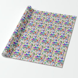 Regnbågsfärgpenslar på färg presentpapper