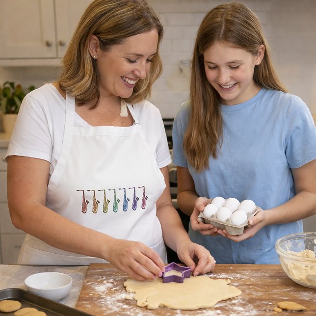 Regnbågssaxofoner Musik för musiker Förkläde (An apron with a pretty lineup of rainbow saxophones.)