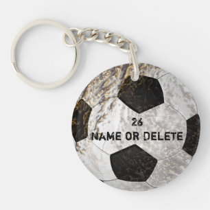 Rengöringen och smutsar ner den fotbollKeychains