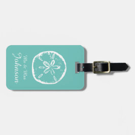 Resetaggar för resgods på sandstrand bagagebricka