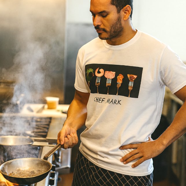 Restauranger Chef Shirt Tee (Chef at the sauté station in bold fork-and-food tee, steam rising in a pro kitchen blaze)