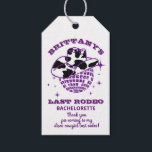 Retro Disco Cowgirl Bachelorette Party Presentetikett<br><div class="desc">Girly lila glitter disco boll och en mycket retro cowgirl-grupp som skapar perfektens disco cowgirl party-märkre. En holografisk lila,  blå och gult vattenfärgsbakgrund ramar den. Det här objektet är en del av insamlingen av Lila Glitter och Cow Mönster,  där du hittar en mängd bachelorette Party-papper och party.</div>