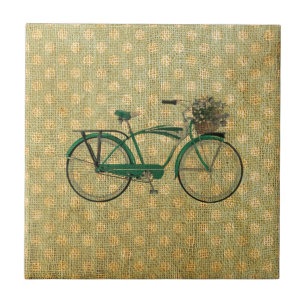 Retro grön cykel med blommabasketen kakelplatta