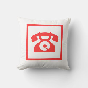 retro röd telefon på vit kudde
