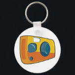 Retro Yellow Point and Shoot Film Camera Nyckelring<br><div class="desc">Keep your passion for photography close at hand with this retro yellow point and shoot camera keychain. This small but vibrant accessory features a stylized cartoon film camera in bright orange and yellow colors, making it easy to find your keys in any bag. It is a perfect stocking stuffer or...</div>