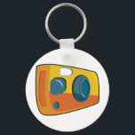 Retro Yellow Point and Shoot Film Camera Nyckelring<br><div class="desc">Keep your passion for photography close at hand with this retro yellow point and shoot camera keychain. This small but vibrant accessory features a stylized cartoon film camera in bright orange and yellow colors, making it easy to find your keys in any bag. It is a perfect stocking stuffer or...</div>
