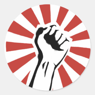 Revolution fist runt klistermärke