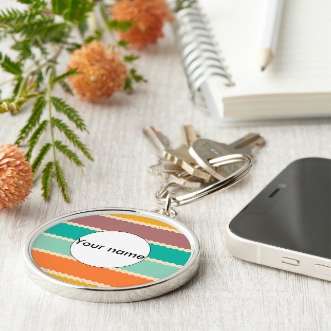 Rhombus-rader abstrakt design rund silverfärgad nyckelring (Sidan)