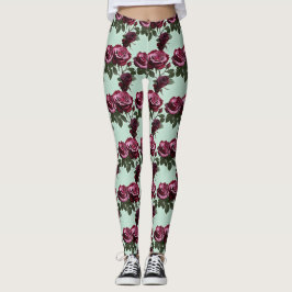 Rika lila och djupröda rosor på en mintgrön bakgru leggings