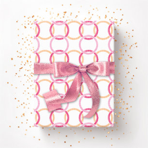 Ringkastning sammankopplade cirklar i rosa och ora presentpapper