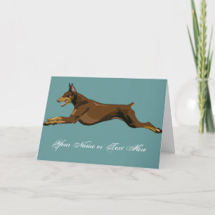 Rinnande Doberman som är röd Kort