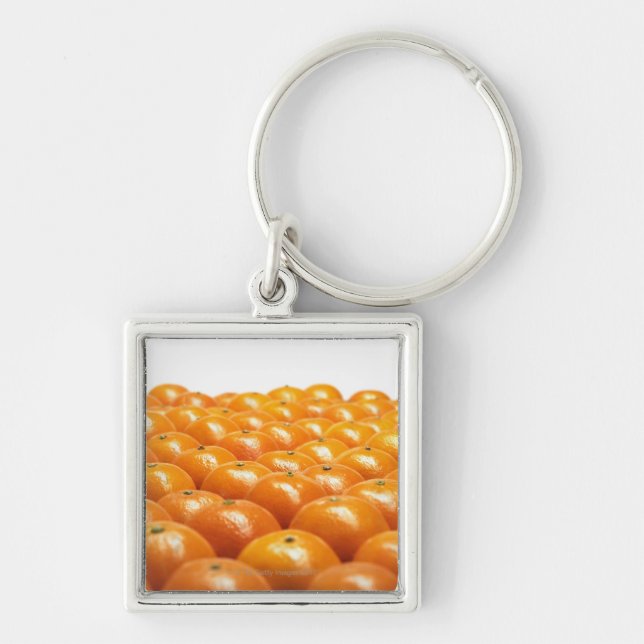 Ro av orangar fyrkantig silverfärgad nyckelring (Framsidan)