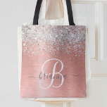 Ro Guld Brushed Metall Glitter Monogram Namn Tygkasse<br><div class="desc">Anpassa enkelt trendigets chic till säcksdesignen med söt silver mousserande faux glitter på en borstad metallbakgrund från ro guld.</div>