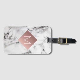 ro guld monogram på svartvit marmorsten bagagebricka