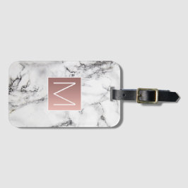 ro guld monogram på svartvit sten bagagebricka