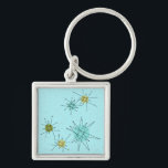 Robin's Egg Blue Atomic Starbursts Keychain Fyrkantig Silverfärgad Nyckelring<br><div class="desc">Denna Robin's Egg Blue Iconic Atomic Starbursts Keychain mönster har ikoniska atomstjärnor. Det är höger! Bakgrunden till den blåa färgaden i old school med guld-späckar är perfektens bakgrund för den pulserande turkosen, kökssleriet och färgaden för päronpäron i grönten. Sportarna i färg placeras sporadiskt i olika storlekar med överliggande V-formad linjer...</div>