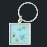 Robin's Egg Blue Atomic Starbursts Keychain Fyrkantig Silverfärgad Nyckelring<br><div class="desc">Denna Robin's Egg Blue Iconic Atomic Starbursts Keychain mönster har ikoniska atomstjärnor. Det är höger! Bakgrunden till den blåa färgaden i old school med guld-späckar är perfektens bakgrund för den pulserande turkosen, kökssleriet och färgaden för päronpäron i grönten. Sportarna i färg placeras sporadiskt i olika storlekar med överliggande V-formad linjer...</div>