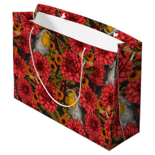 Robins i höstträdgården, röda dahlias på svart