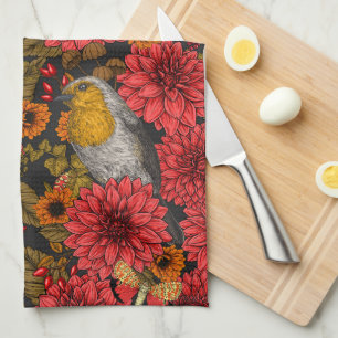 Robins i höstträdgården, röda dahlias på svart kökshandduk