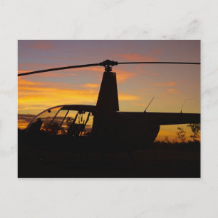 Robinson R44 helikopter vid solnedgång Vykort