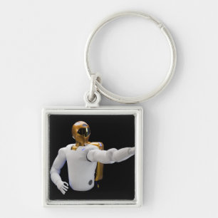 Robonaut 2, ett fingerfärdigt, fyrkantig silverfärgad nyckelring
