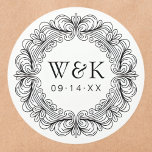 Rococo Couple's Initials Wedding or Save the Date Runt Klistermärke<br><div class="desc">Adorn your invitations, favors, or gifts with these captivating custom labels, featuring an exquisite circular border of ornate Baroque scrollwork. This artistic wreath beautifully frames your personalized monogram initials and an important date, adding a sophisticated and luxurious touch to any item. These high-quality, peel-and-stick labels offer ultimate convenience, providing a...</div>