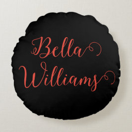 Röd anteckning på svart rund kudde