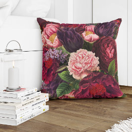 Röd burgundär djup lila och blommor av rosa kudde