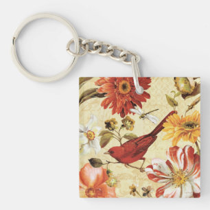 Röd fågel i en blomsterträdgård