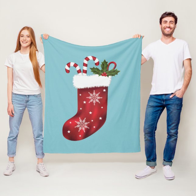 Röd festlig julstrumpa på blå bakgrund  fleecefilt (På plats)