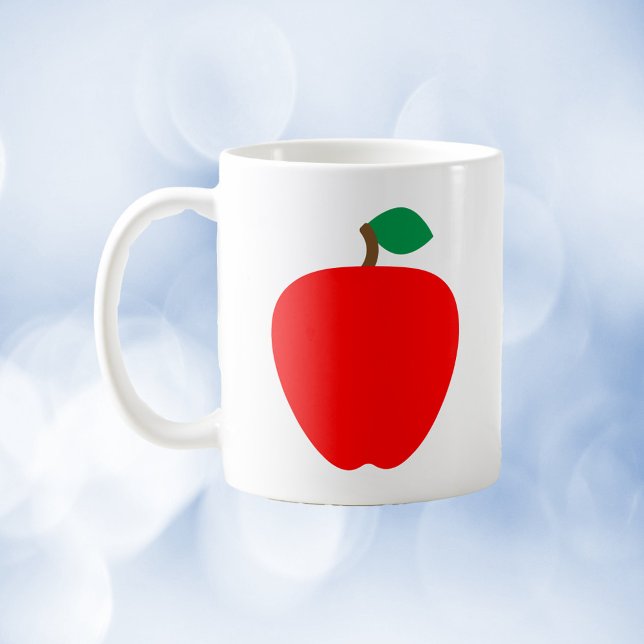 Röd frukt av äpple kaffemugg (A mug with a graphic of a red apple.)