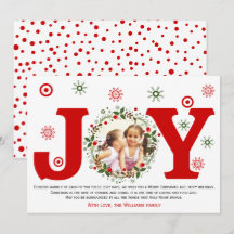 Röd glädje och julblomsterkransfoto