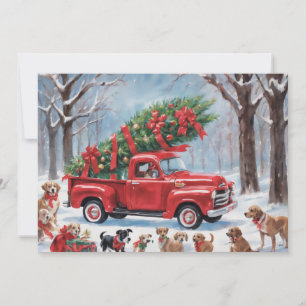 Röd jul-lastbil i den snöiga skogen med hundar julkort
