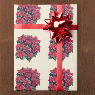 Röd julstjärna julblomma på ljust gult presentpapper