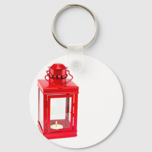 Röd lykta med brinna tealight på vit nyckelring