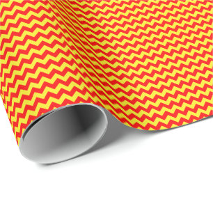 Röd och gul liten sparre som slår in papper presentpapper