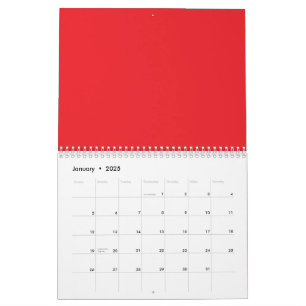 Röd och orange kritor som ljuger sida vid sida på  kalender