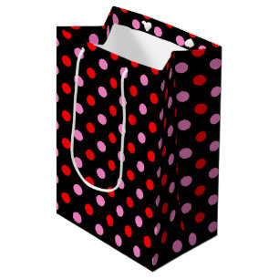 Röd och rosa på svart prickig design