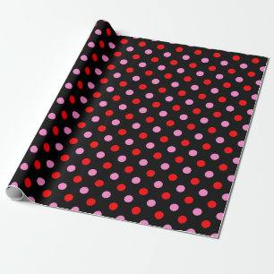 Röd och rosa på svart prickig design presentpapper