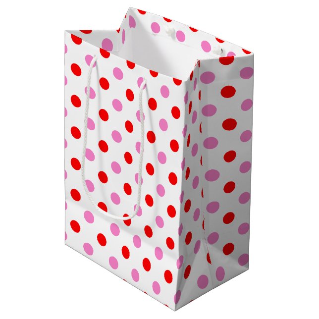 Röd och rosa på vit prickig design (Framsidan Vinklad)