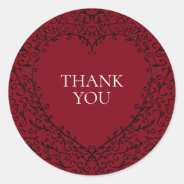 Röd- och svart-hjärtstillestånd runt klistermärke