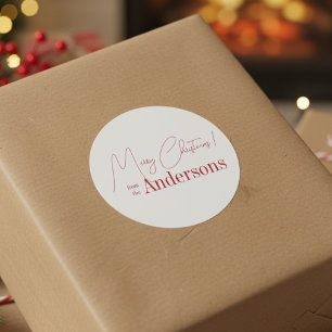 Röd och vit jul från familjenamn runt klistermärke